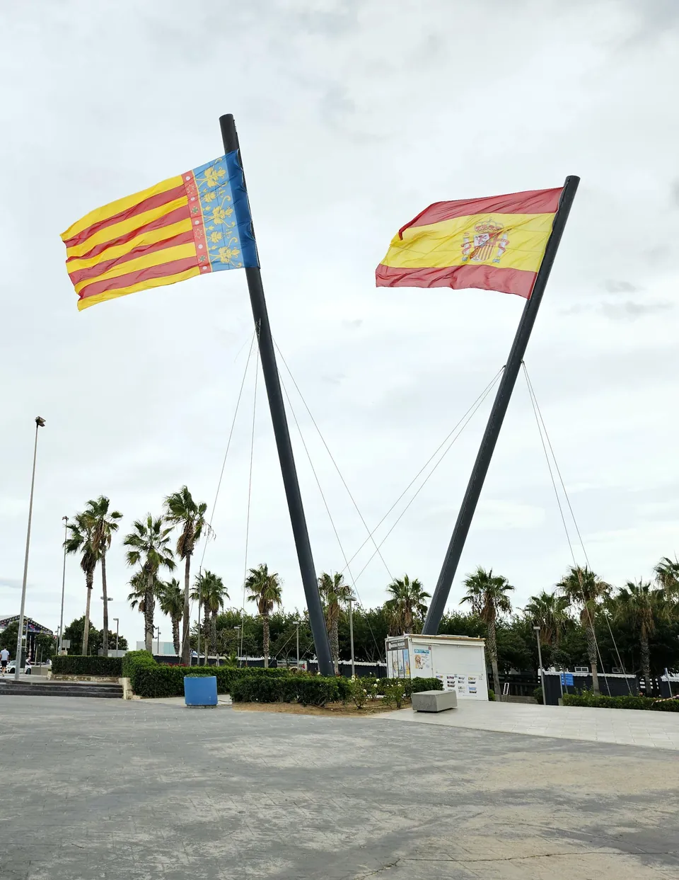 Flags of the Valencian Community and Spain flying at the Marina de València